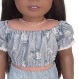 T71.  18" doll crop top. Dusty blue peasant blouse with tulips and lace trim.
