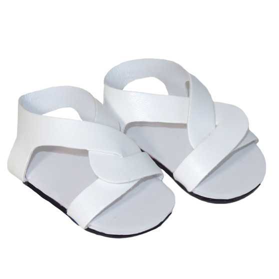 Fits 18" dolls like American Girl and Our Generation

These 18" doll sandals are perfect for the summer season. Featuring a stylish slip-on design, these sandals are made from a bright white material that will make any outfit pop. The criss-cross design adds a trendy touch to these sandals, making them a great addition to any doll's wardrobe. These sandals are comfortable and easy to wear, perfect for a day out in the sun. Give your doll a cute and stylish look this summer with these adorable white criss-cross slip-on sandals.