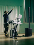 JBL PRX ONE Column PA System with 7-channel Digital Mixer, DSP & FX, Bluetooth, 2kW Peak - 457568-JBL_PRX-ONE_LifestylePhoto_DJ_Male_2.jpg