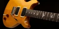 PRS SE Santana Electric Guitar in Santana Yellow - SE-SASY-PRS-SE-Santana-Yellow-Lifestyle.jpg