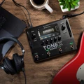 IK Multimedia TONEX Board Guitar & Bass Processor - TONEX-BOARD-Headphones-Guitar-Laptop.jpg