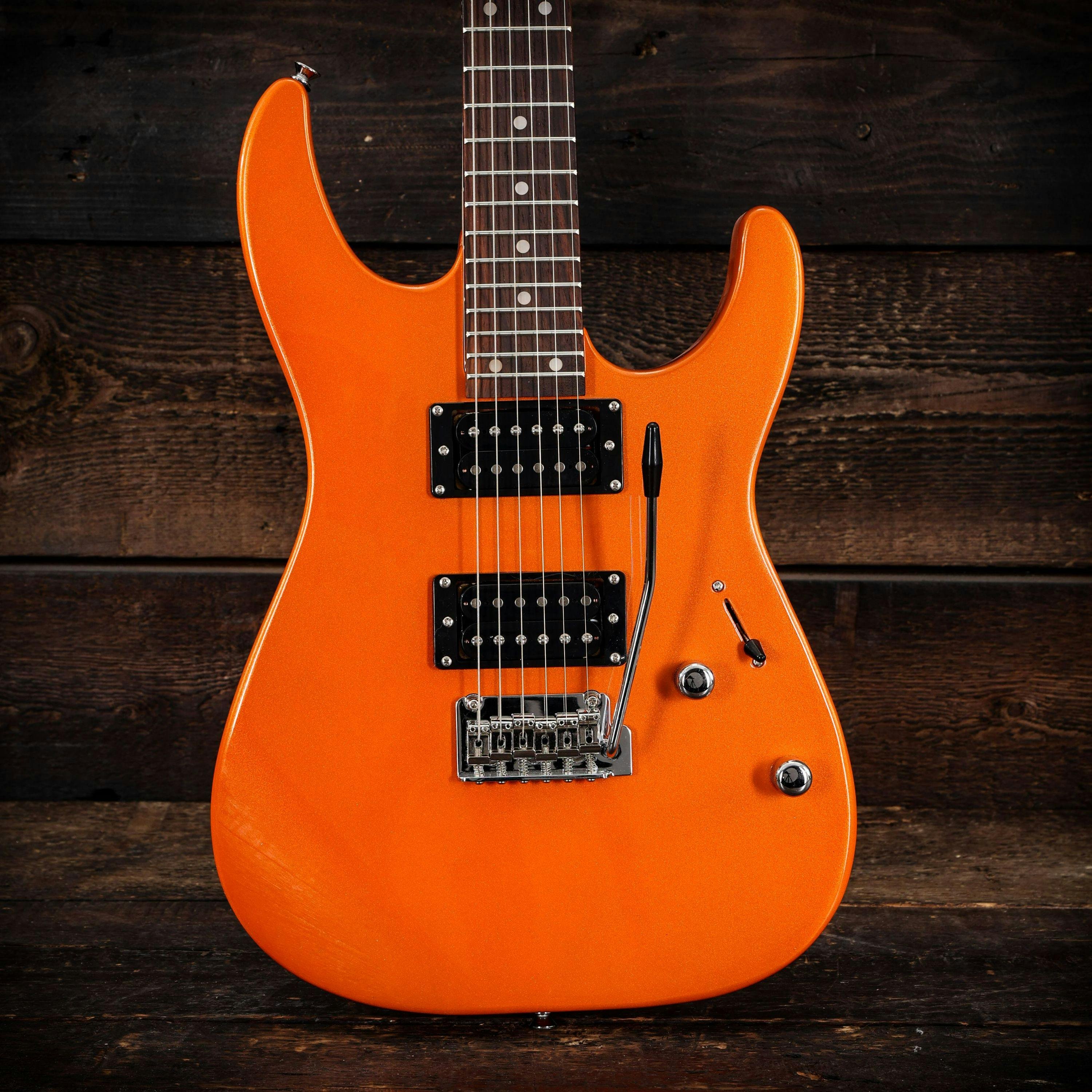EastCoast HM1 Electric Guitar in Metallic Orange - 479496-EastCoast HM1 Electric Guitar in Metallic Orange wood background.jpg