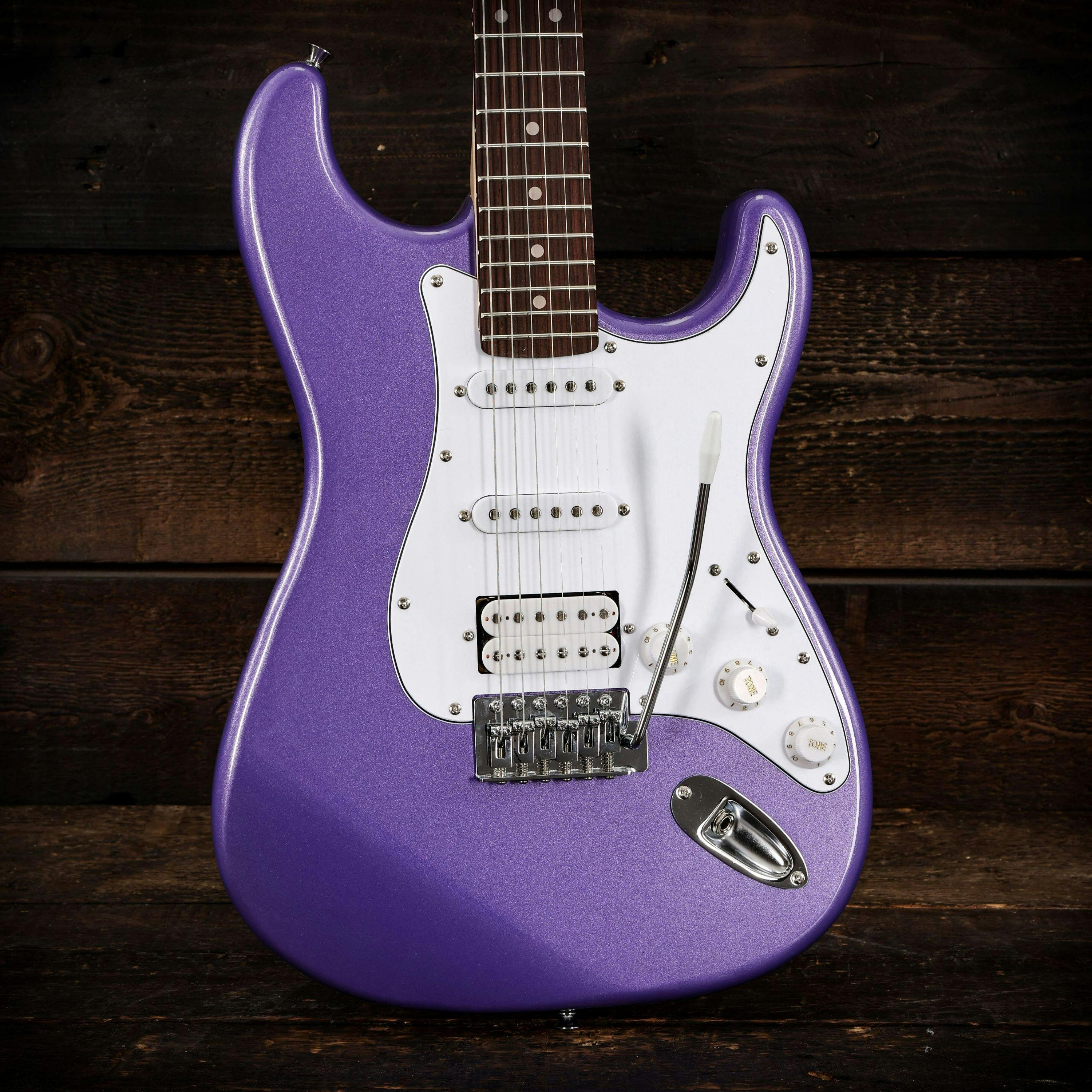 EastCoast ST2 HSS Mint Pickguard Electric Guitar in Purple Metallic - 479495-Eastcoast ST2 HSS Electric Guitar in Purple Metallic Rosewood Fretboard wood background.jpg