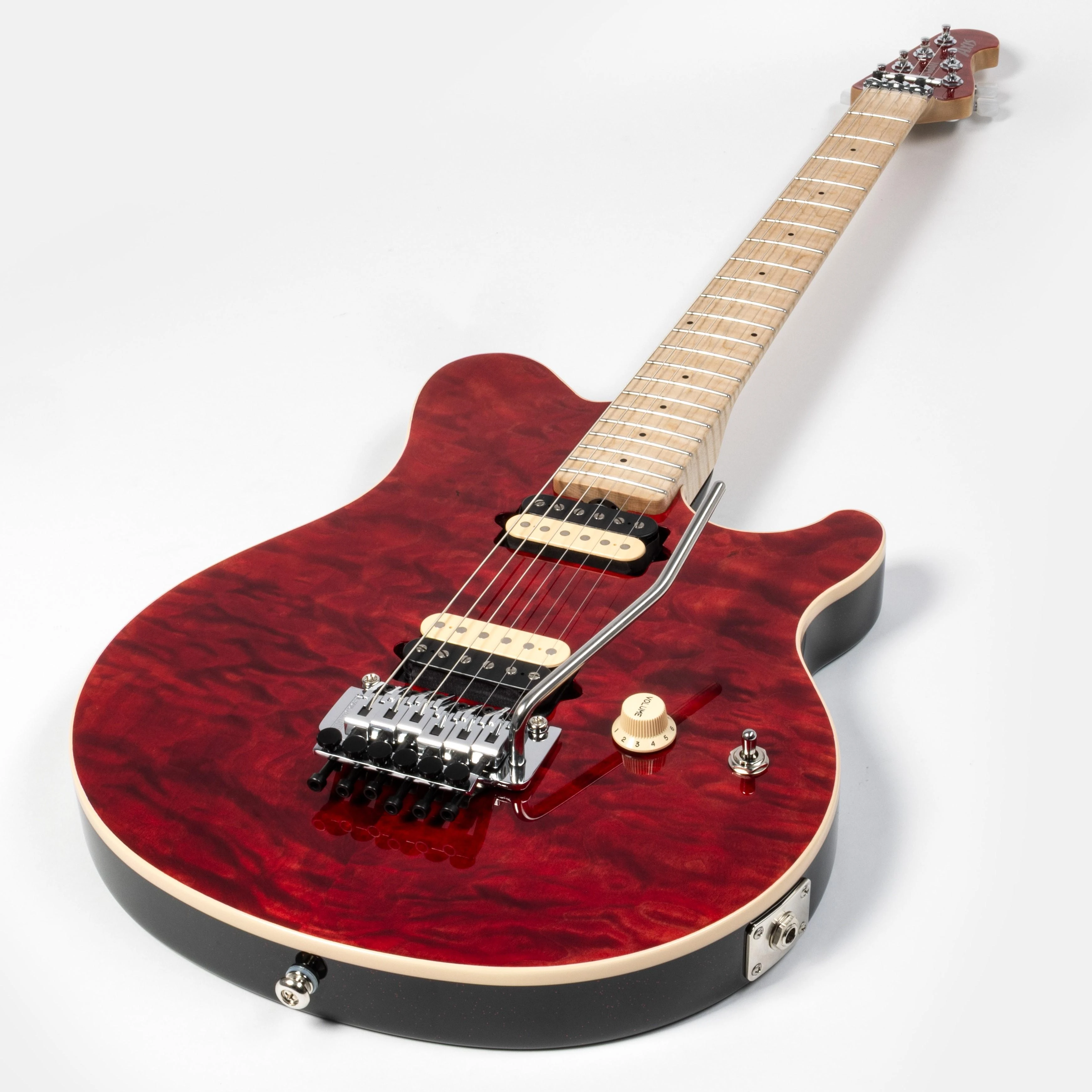 Music Man 30th Anniversary Axis Electric Guitar in Translucent Red Quilt - 30330R11R00TBCR-Angle.jpg