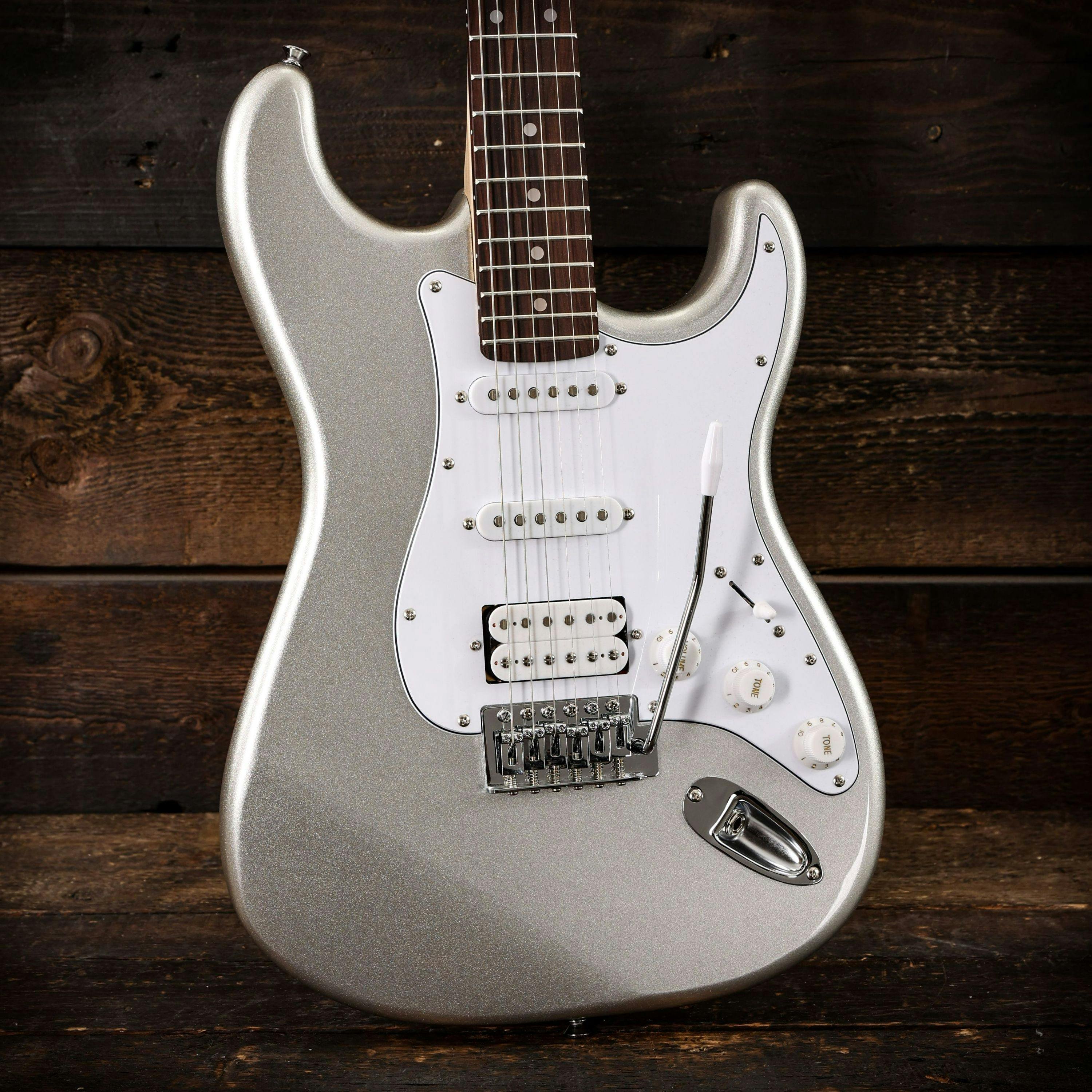 EastCoast ST2 HSS Electric Guitar in Slick Silver Metallic - 479506-EastCoast ST2 HSS Electric Guitar in Slick Silver Metallic wood background.jpg