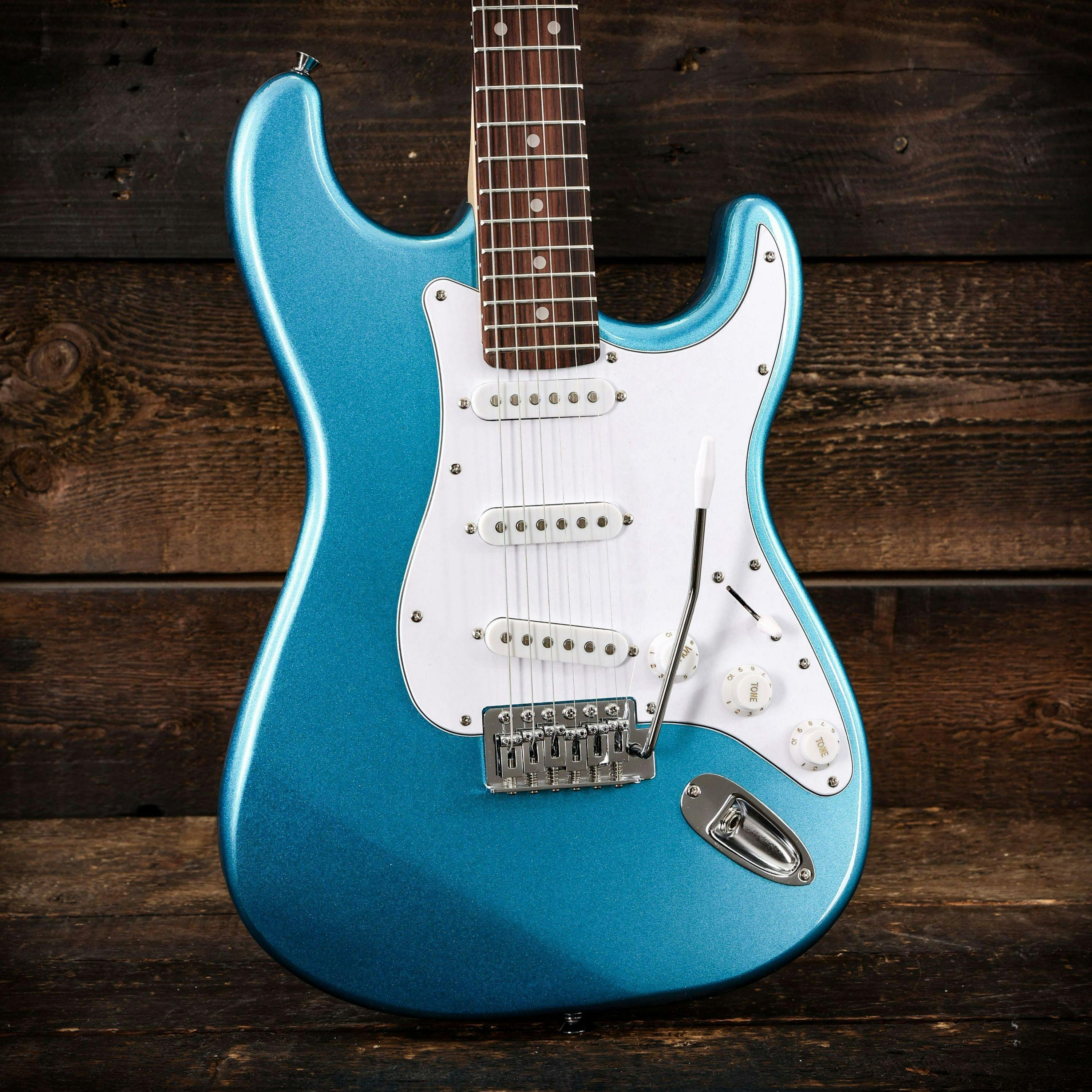EastCoast ST1 Electric Guitar in Lake Placid Blue with Rosewood Fretboard - 479501-Eastcoast ST1 Electric Guitar in Lake Placid Blue wood background.jpg