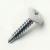 A 25mm x 4.2mm Painted Wafer Head Self drilling Screws - BZP Steel with a RAL 9016 Traffic White powder coated coloured screw head.