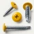 Various angles of the RAL 1023 traffic yellow painted wafer head self drilling screws for metal work and framing