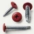 Various angles of the carmine red painted wafer head screws with drill points for metal work and framing.