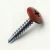 A 25mm x 4.2mm Painted Wafer Head Self drilling Screws - BZP Steel with a RAL 3009 Oxide Red powder coated coloured screw head.
