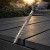DeckingPro DS50 RAL 7016 Anthracite Grey colour matched composite decking screw shown on charcoal composite decking boards outdoor