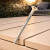 DeckingPro DS65 RAL 1015 Light Ivory colour matched composite decking screw shown on ivory composite decking boards outdoor
