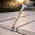 DeckingPro DS50 RAL 7035 Light Grey colour matched composite decking screw shown on light grey composite decking boards outdoor