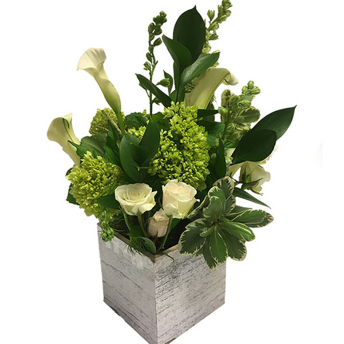Fresh flower arrangement featuring calla lilies