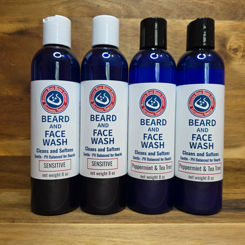 Tall blue 8-ounce bottle of Beard and Face Wash by Moccasin Bend Beard Company.