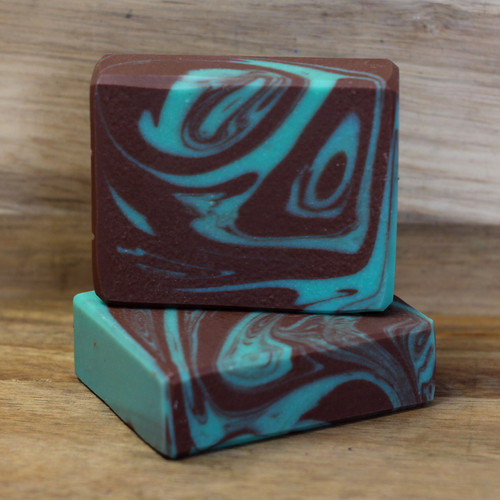 A dark green and dark brown swirled bar of soap.