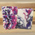 A white bar of soap with hot pink, black, and purple swirls.