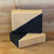 A black and light gold bar of sharp dressed man soap.