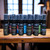 A collection of multiple, half oz, black ,spray bottle of body cologne from moccasin bend beard.