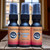 A collection of multiple, half oz, black ,spray bottle of body cologne from moccasin bend beard in the scent Acoustic Cafe.