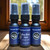 A collection of multiple, half oz, black ,spray bottle of body cologne from moccasin bend beard in the scent One Eyed Jack.