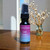 A small, half oz, black ,spray bottle of body perfume from moccasin bend soap in the scent Love Potion.