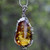 Green Baltic Amber Pendant in Silver Setting with Leaf Design