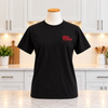 The front of a Door County Coffee Cherry logo t-shirt in a white kitchen