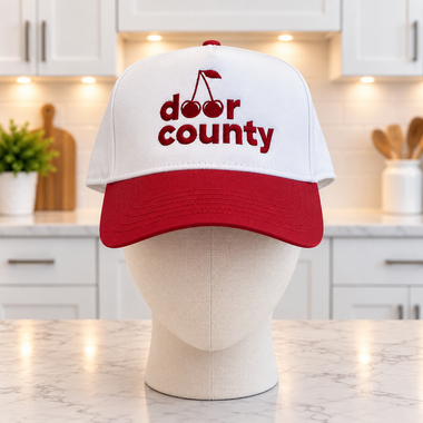 Door County Cherry Trucker hat in a white kitchen