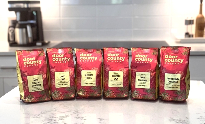 A festive decorated box revealing holiday inspired coffee flavors