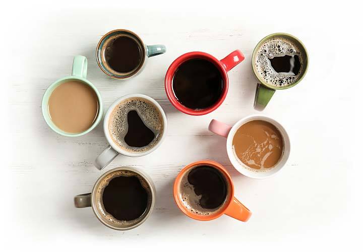 overhead view of colorful coffee mugs with varying brew strengths