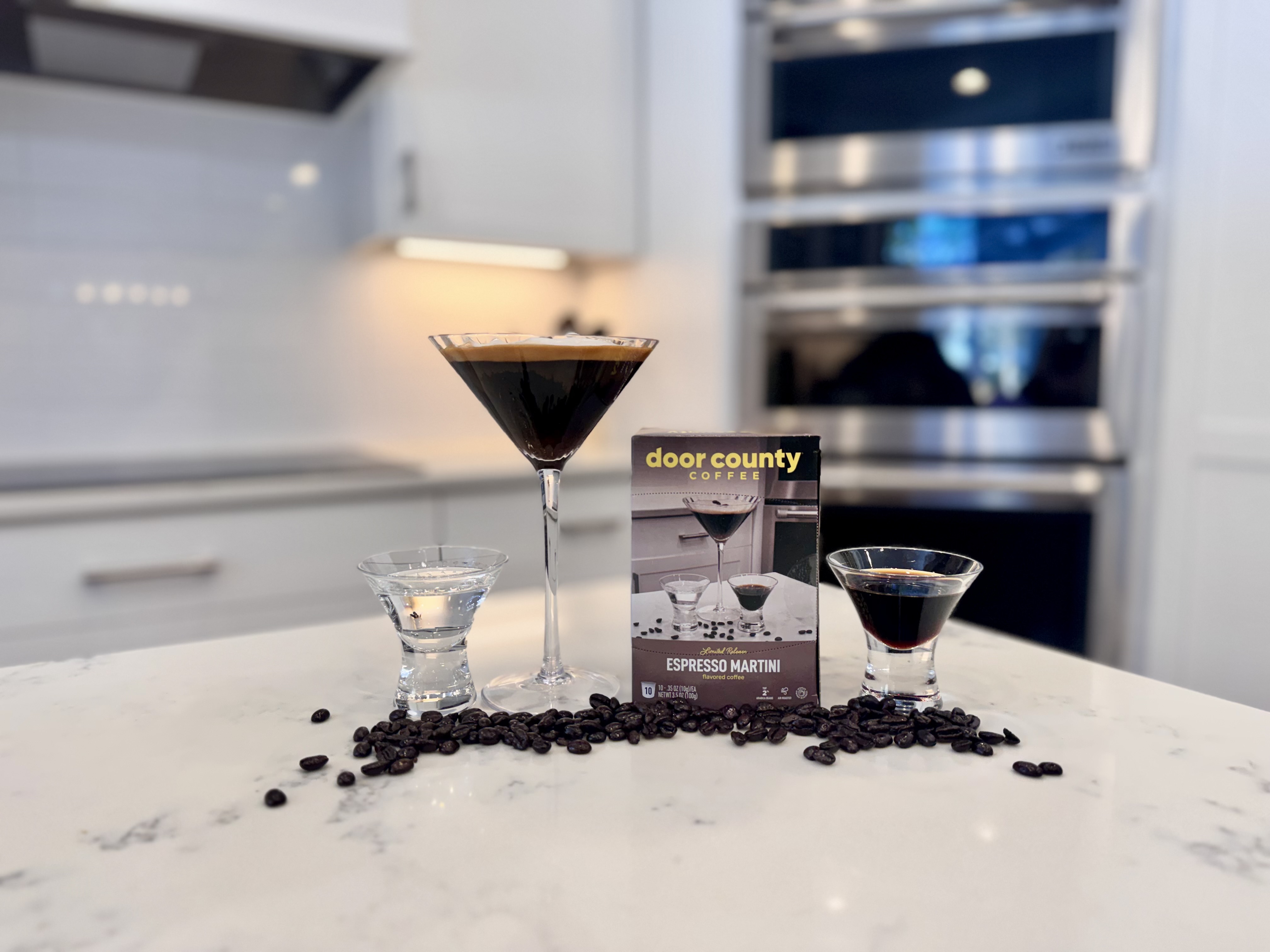 A bag of coffee with an Espresso Martini by it