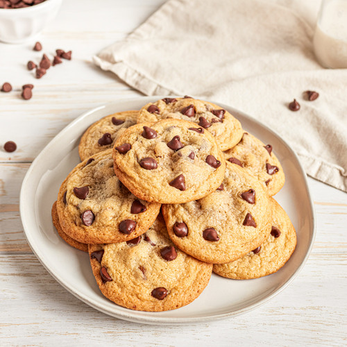 https://cdn11.bigcommerce.com/s-4jk7tirfaw/products/1721/images/7968/5b069c3ed2feea79377014f6766fcd49_Original_NTH_Chocolate_Chip_Cookie__83966.1703861790.500.750.jpg?c=2