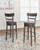 Caitbrook - Tall UPH Swivel Barstool - Gray
