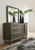 Arkenton - 7 Pc. - Dresser, Mirror, California King Panel Bed, 2 Nightstands - Grayish Brown
