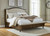 Sturlayne - 7 Pc. - Dresser, Mirror, King Upholstered Panel Bed, 2 Nightstands - Brown