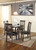 Hammis - Round DRM Drop Leaf Table - Dark Brown