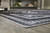 Arloman - 5' x 7' Rug - Black / Cream / Gray