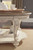 Realyn - Oval Cocktail Table - White / Brown