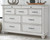 Kanwyn - 7 Pc. - Dresser, Mirror, King Panel Bed, 2 Nightstands - Whitewash