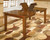Ralene - 7 Pc. - Extension Table, 6 Side Chairs - Light Brown