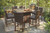 Paradise Trail - 9 Pc. - Fire Pit Table, 8 Barstools - Medium Brown