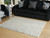 Turinwith - 5' x 7' Rug - Ivory / Black