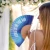 Hand fan "love is in the air" gradient blue