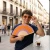 Hand fan orange and purple waves
