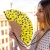 Hand fan yellow dots