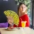 Hand fan yellow dots