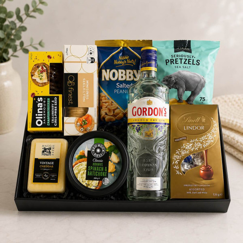 Indulgence Hamper with crackers, pretzels, Lindt chocolates, nuts, cheeses, and 700 ml spirits and more, wrapped in cellophane with ribbons, ready for delivery same-day Naracoorte.