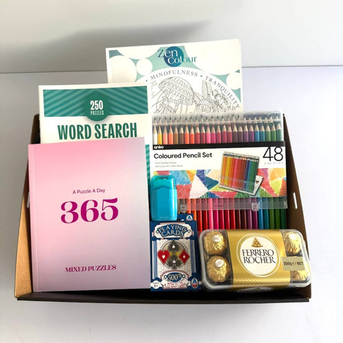 Puzzle gift box. Relax and enjoy colouring with the colouring book and pencils. Play card, Word search, Puzzle book, Pencil, rubber and Ferrero Rochers.