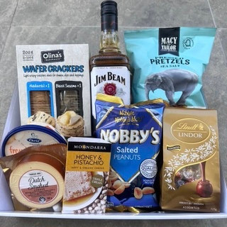Gentleman’s Indulgence Hamper with crackers, pretzels, Lindt chocolates, nuts, cheeses, and 700 ml spirits, wrapped in cellophane with ribbons